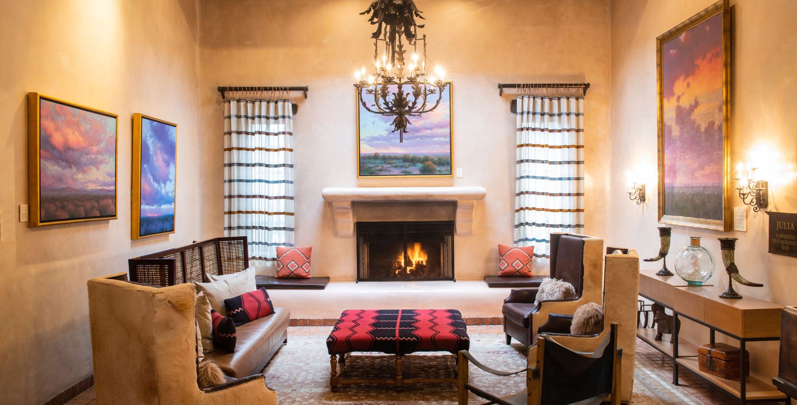 a room with a fireplace and couches