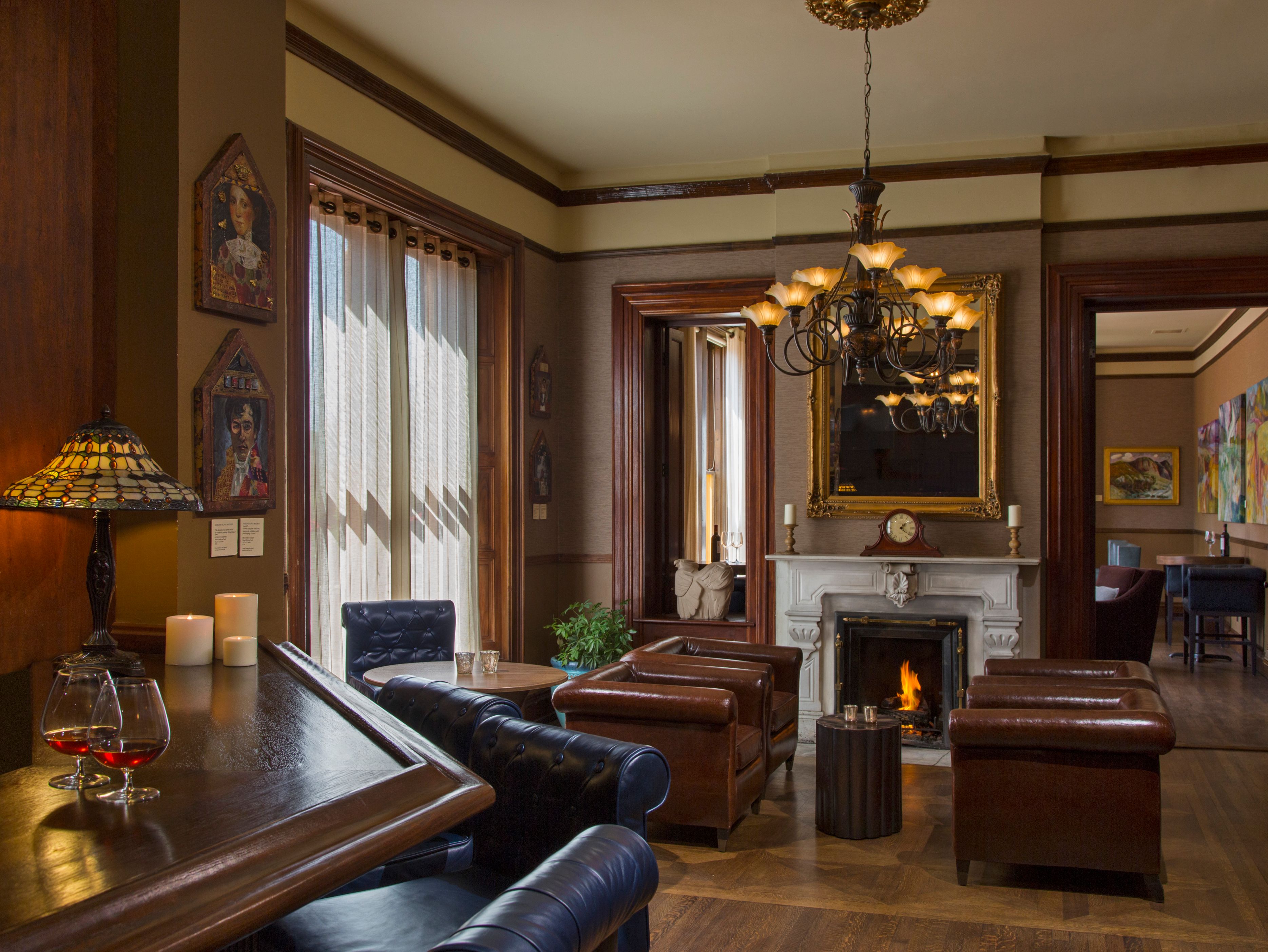 a room with a fireplace and couches