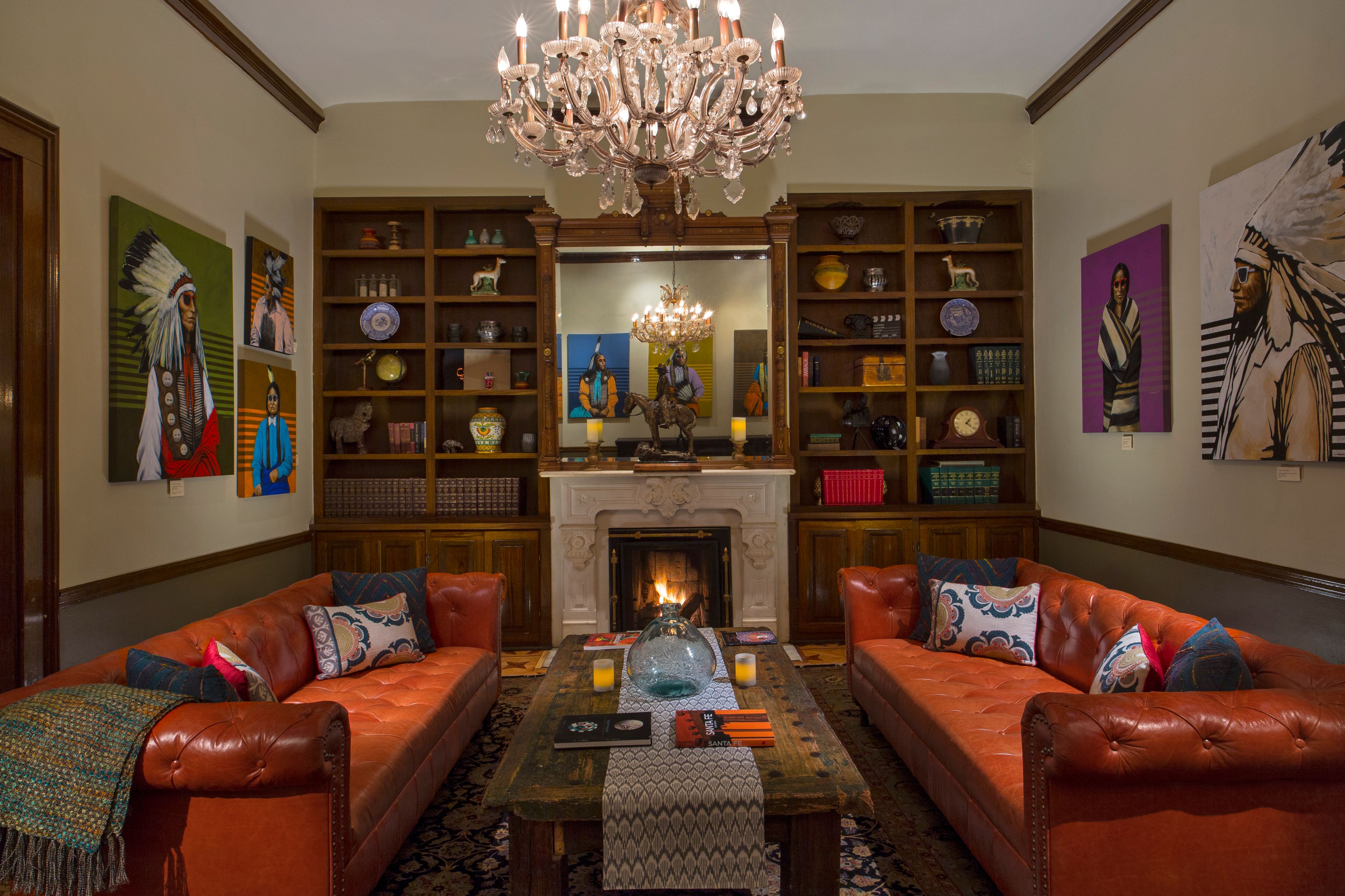 a living room with a chandelier and couches