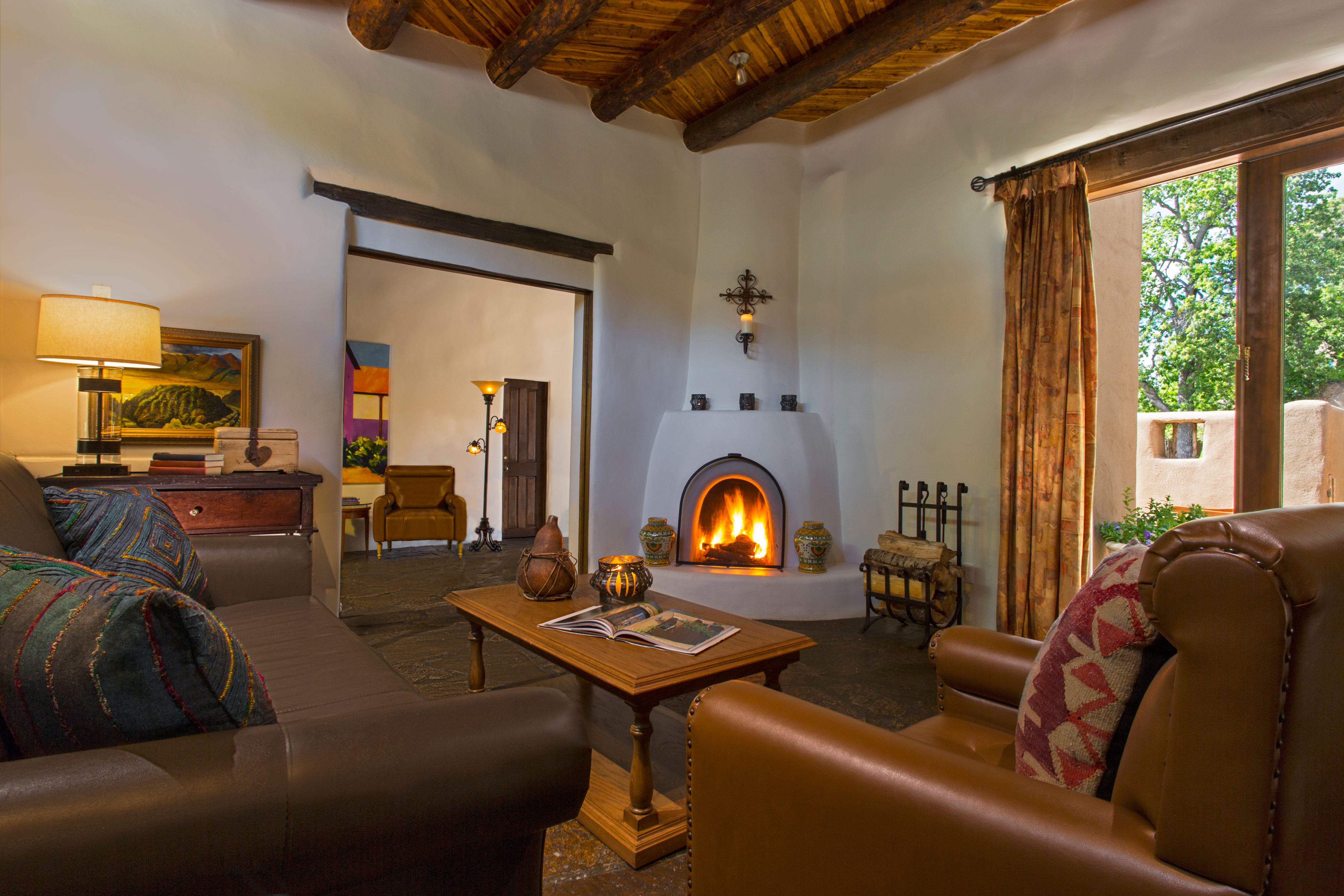 a room with a fireplace and couches