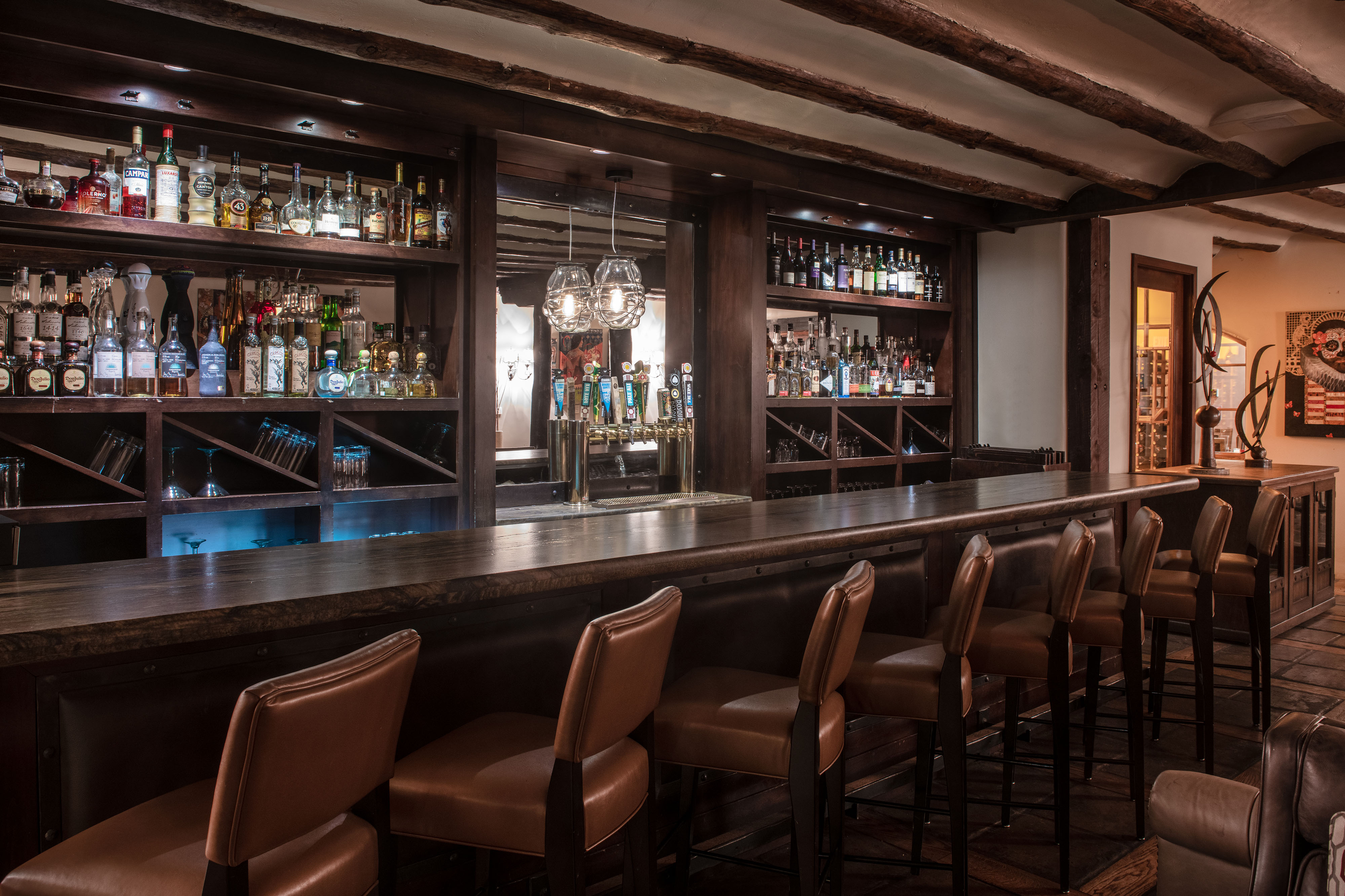 a bar with bottles of alcohol