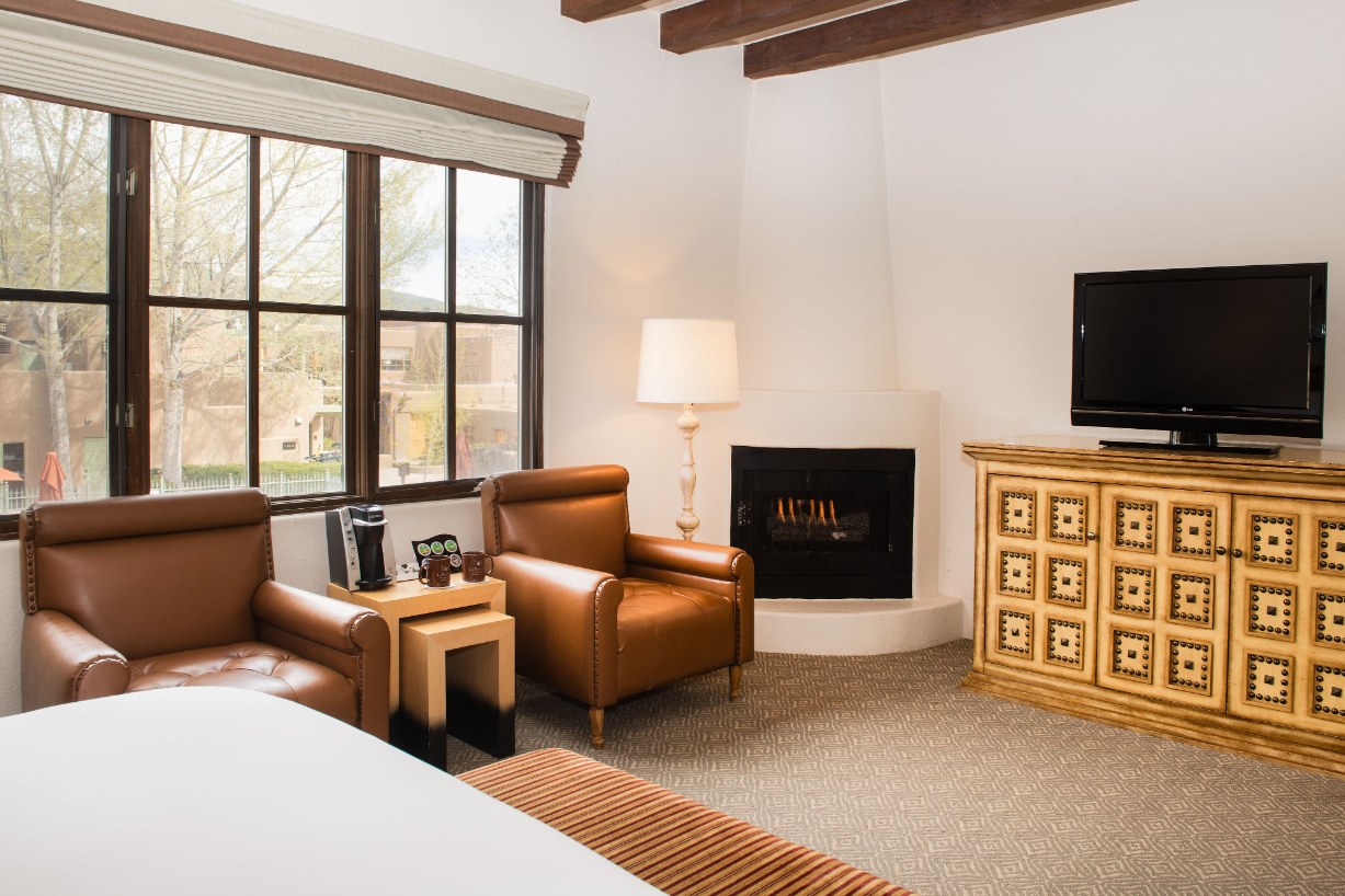 a room with a fireplace and a bed