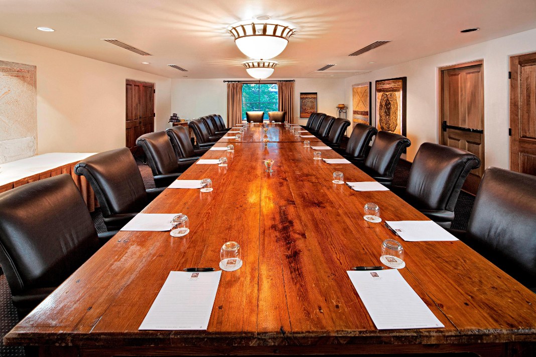 a conference room with a table and chairs