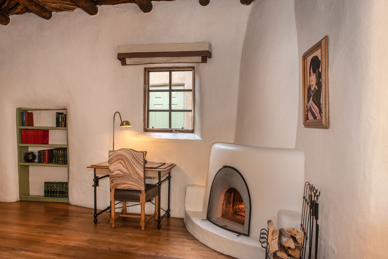 a room with a fireplace and a desk