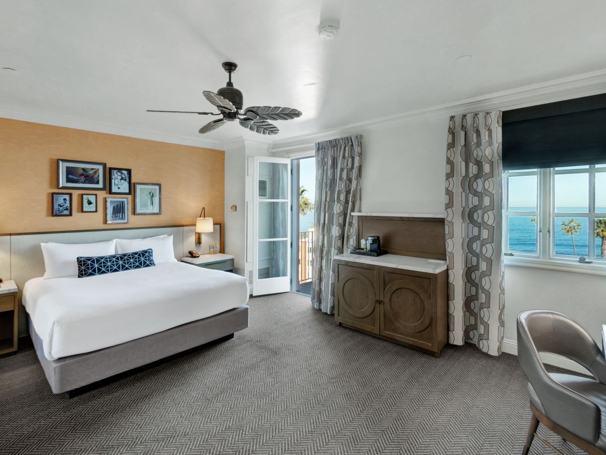 a room with a bed and a ceiling fan