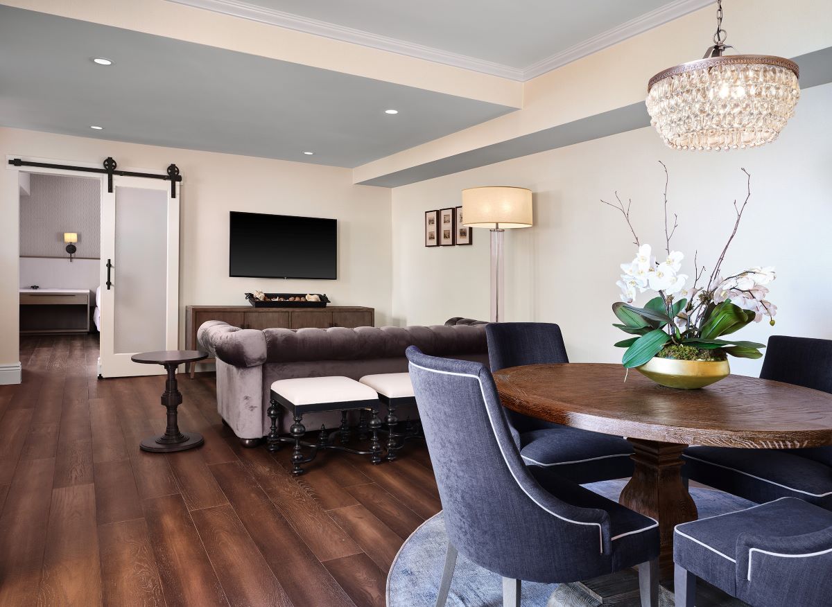 a living room with a table and chairs