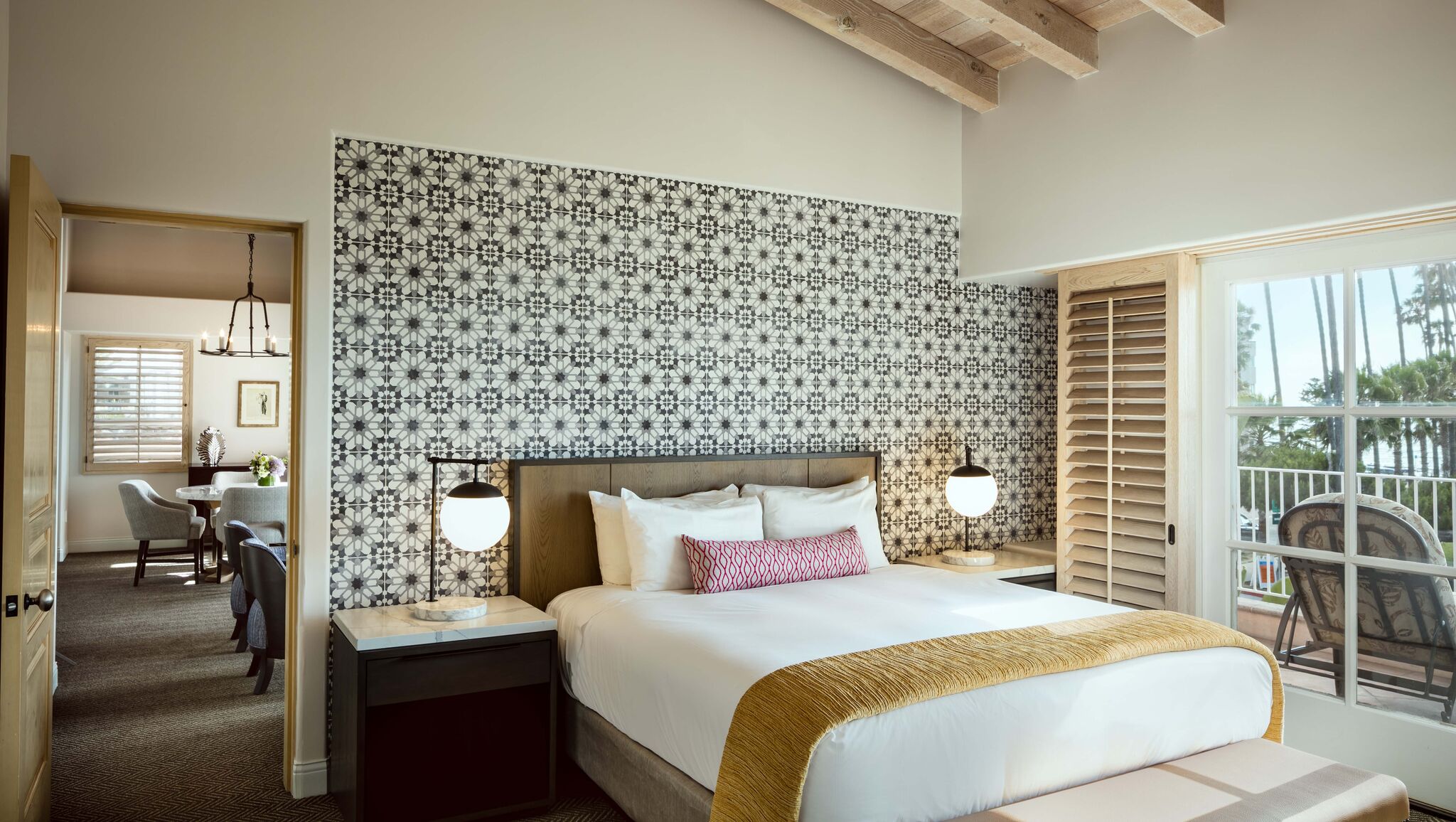 a bed with a lamp next to a wall