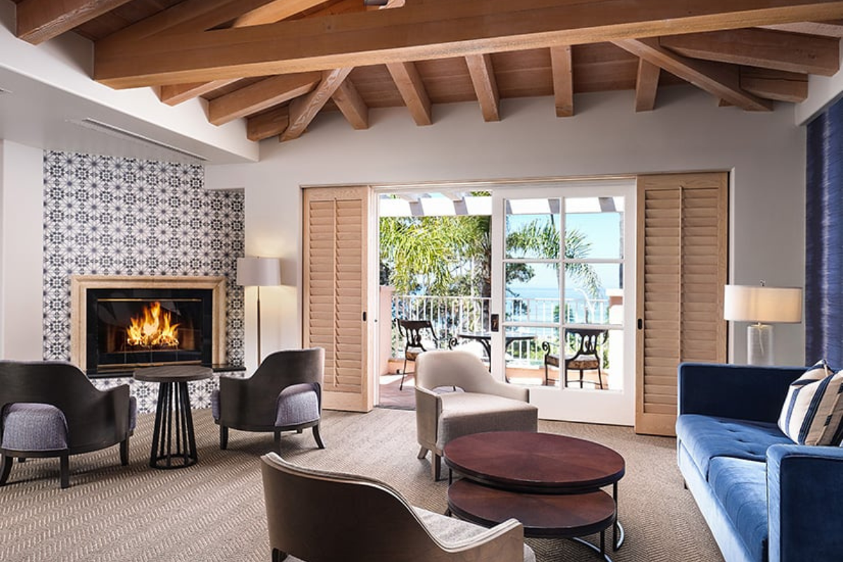 a living room with a fireplace and furniture