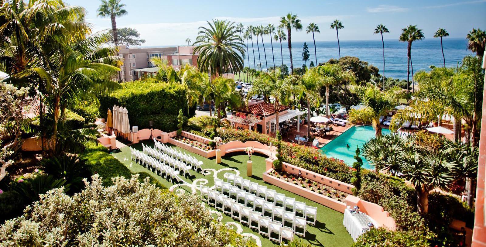 a wedding venue with chairs and a pool