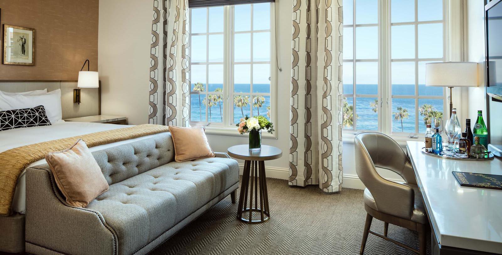 a room with a couch and a table and chairs