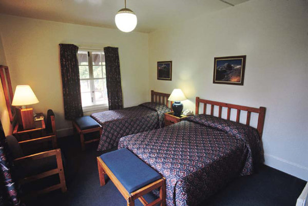 image of main lodge room with two beds lake mcdonald lodge glacier national park montana_high