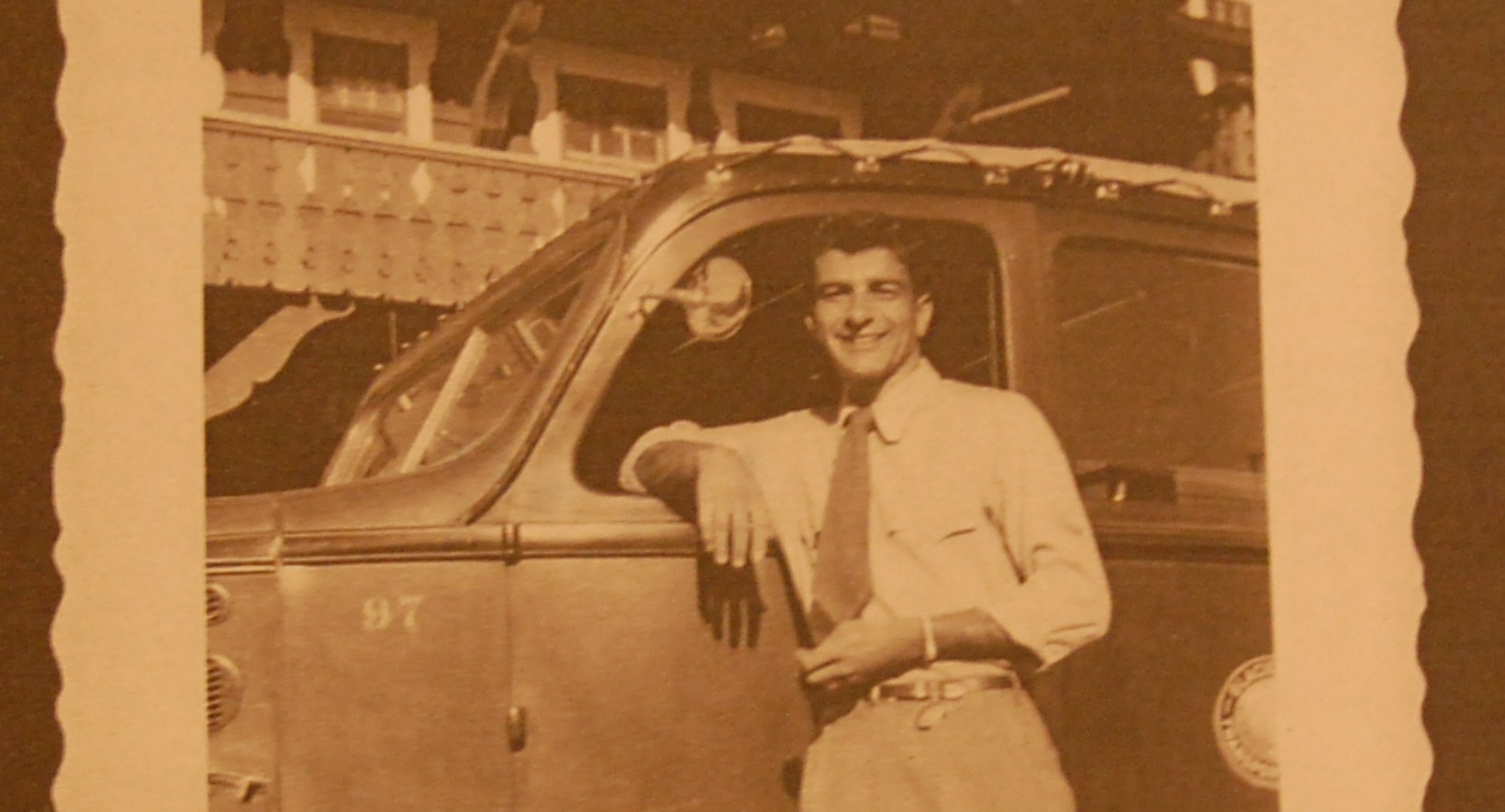 a man leaning out of a car window
