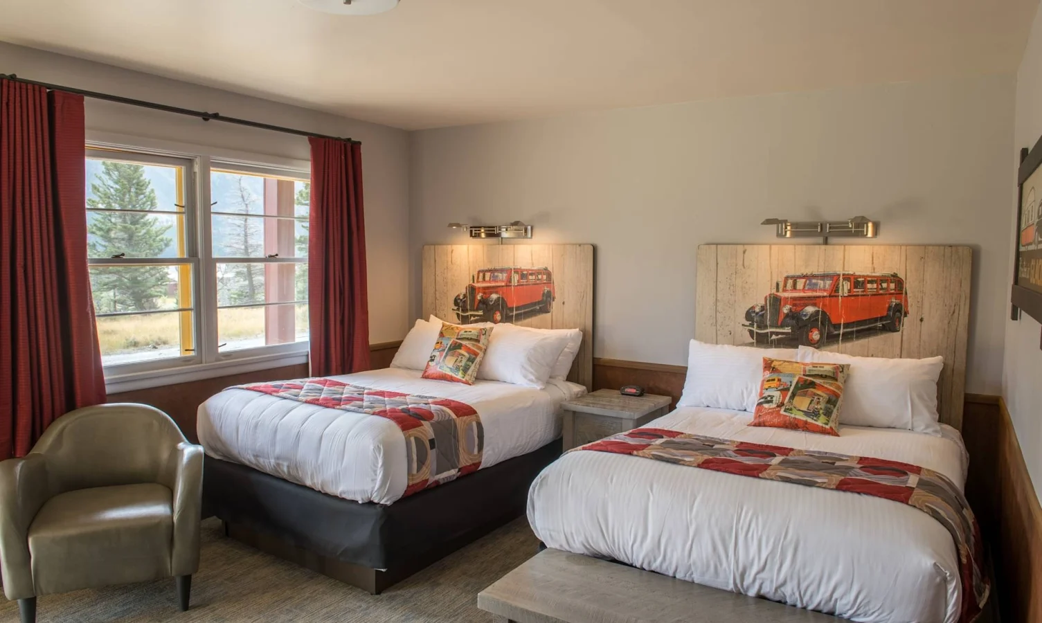 a room with two beds and a window