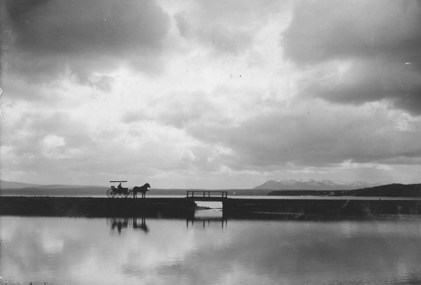 historical image of horse and buggy crossing lake bridge lake yellowstone hotel and cabins yellowstone national park wyoming_high