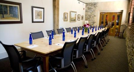 a long table with blue bottles on it