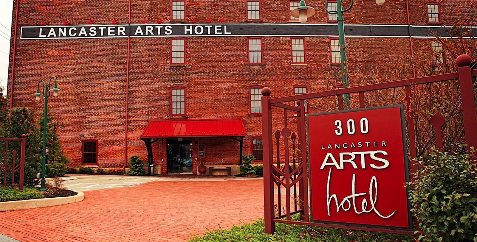a red sign in front of a brick building