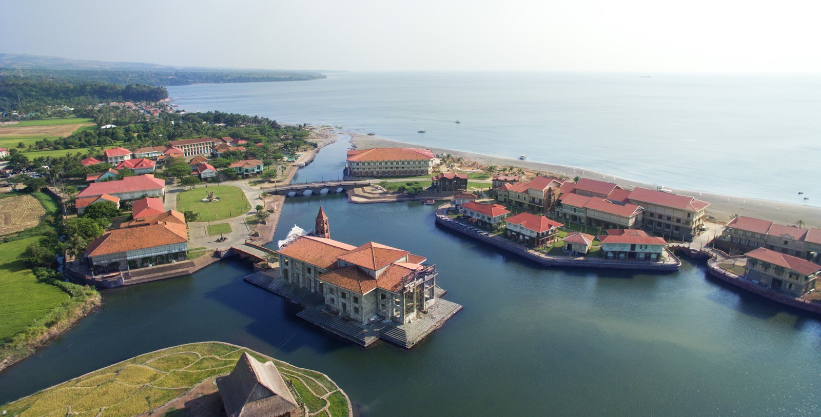 a group of buildings on a body of water