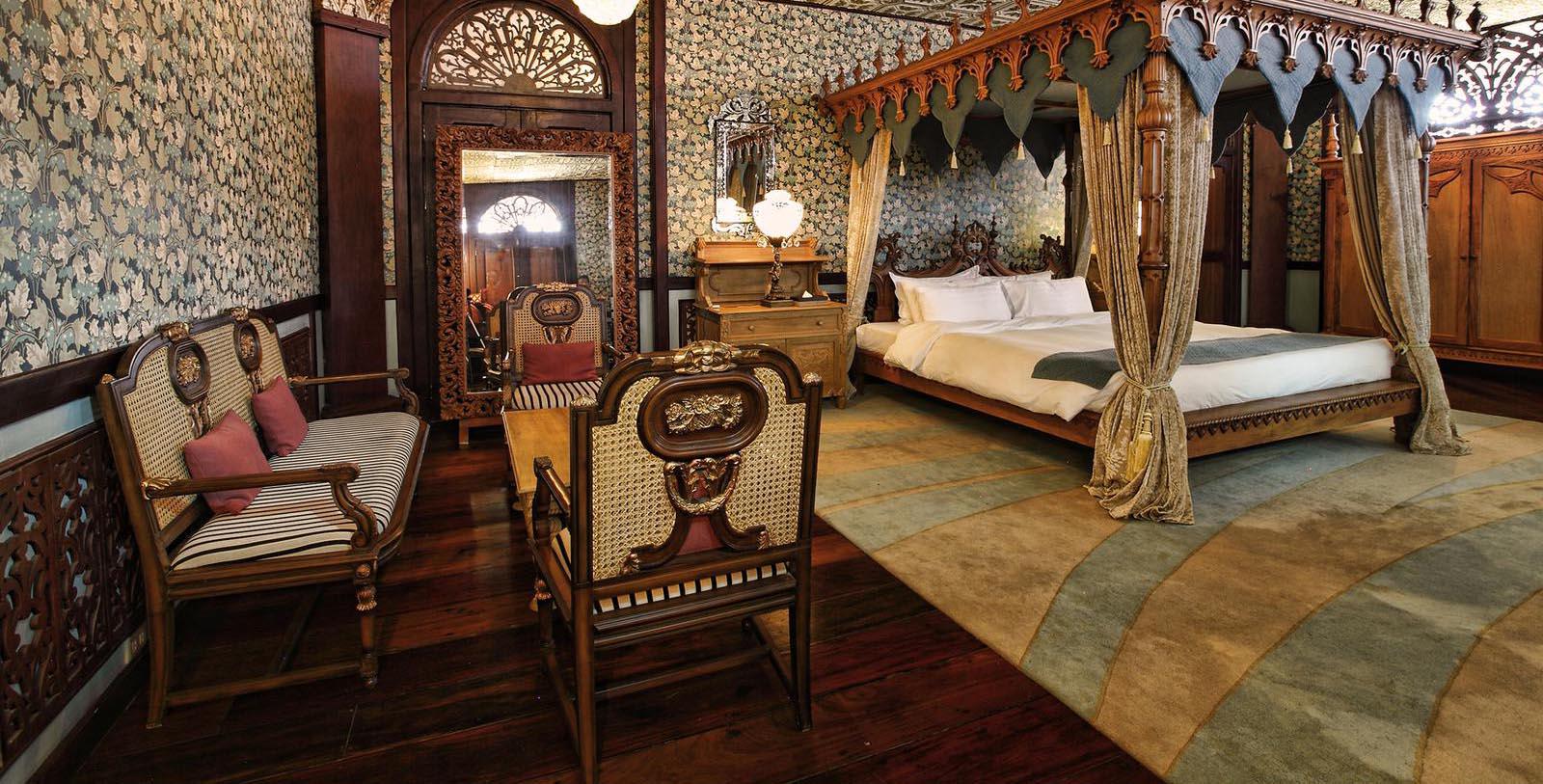 a room with a bed and a mirror