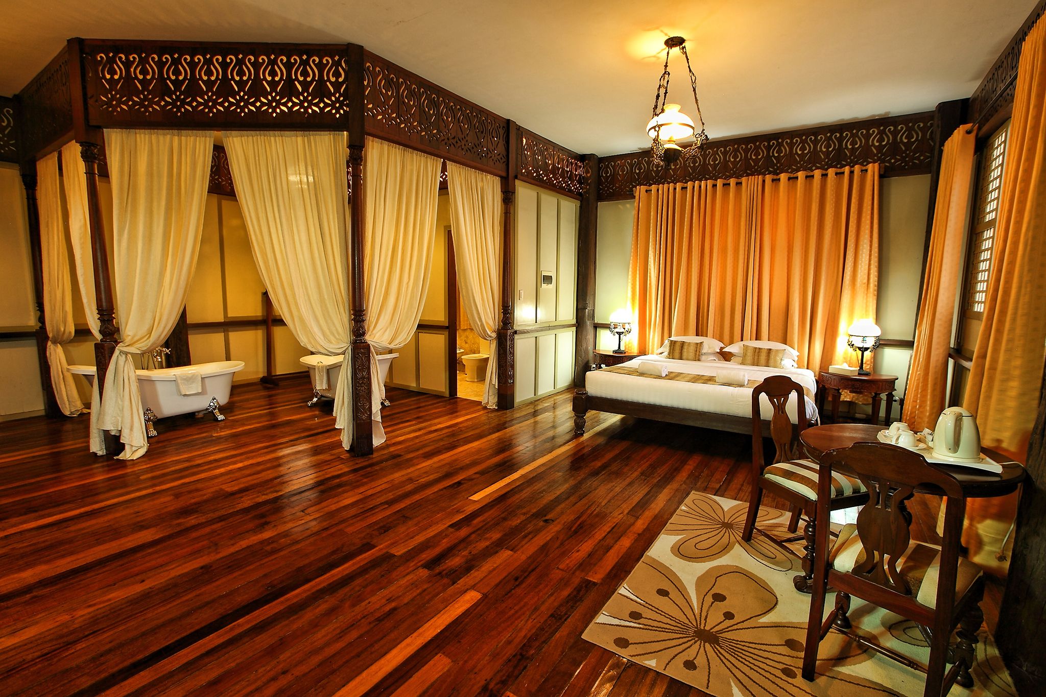 a room with a bed and a bathtub
