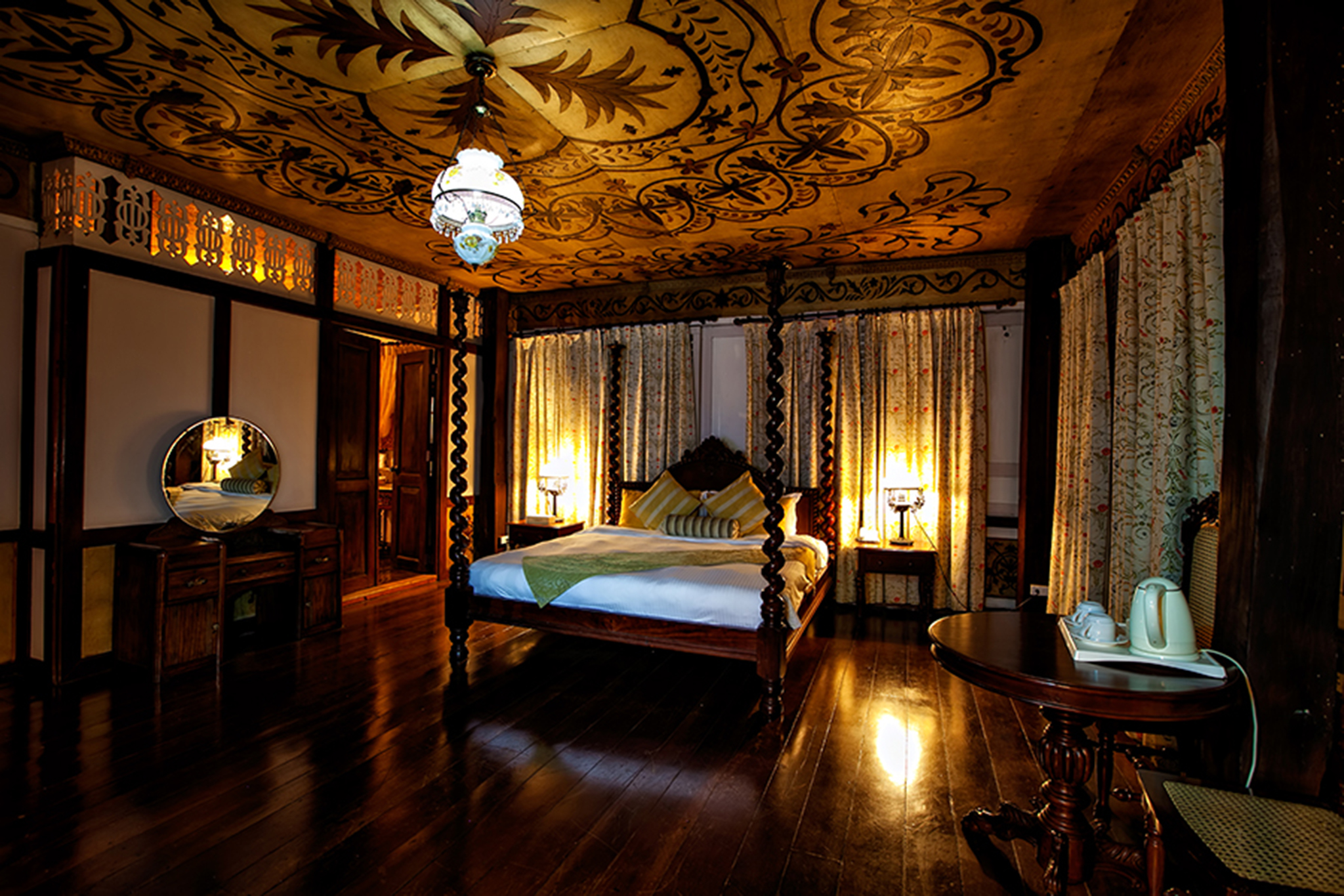 a room with a bed and a mirror