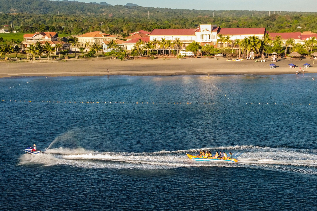 a group of people in a boat on a body of water