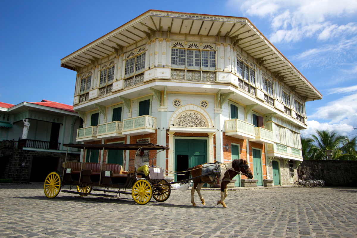 a horse drawn carriage in front of a building