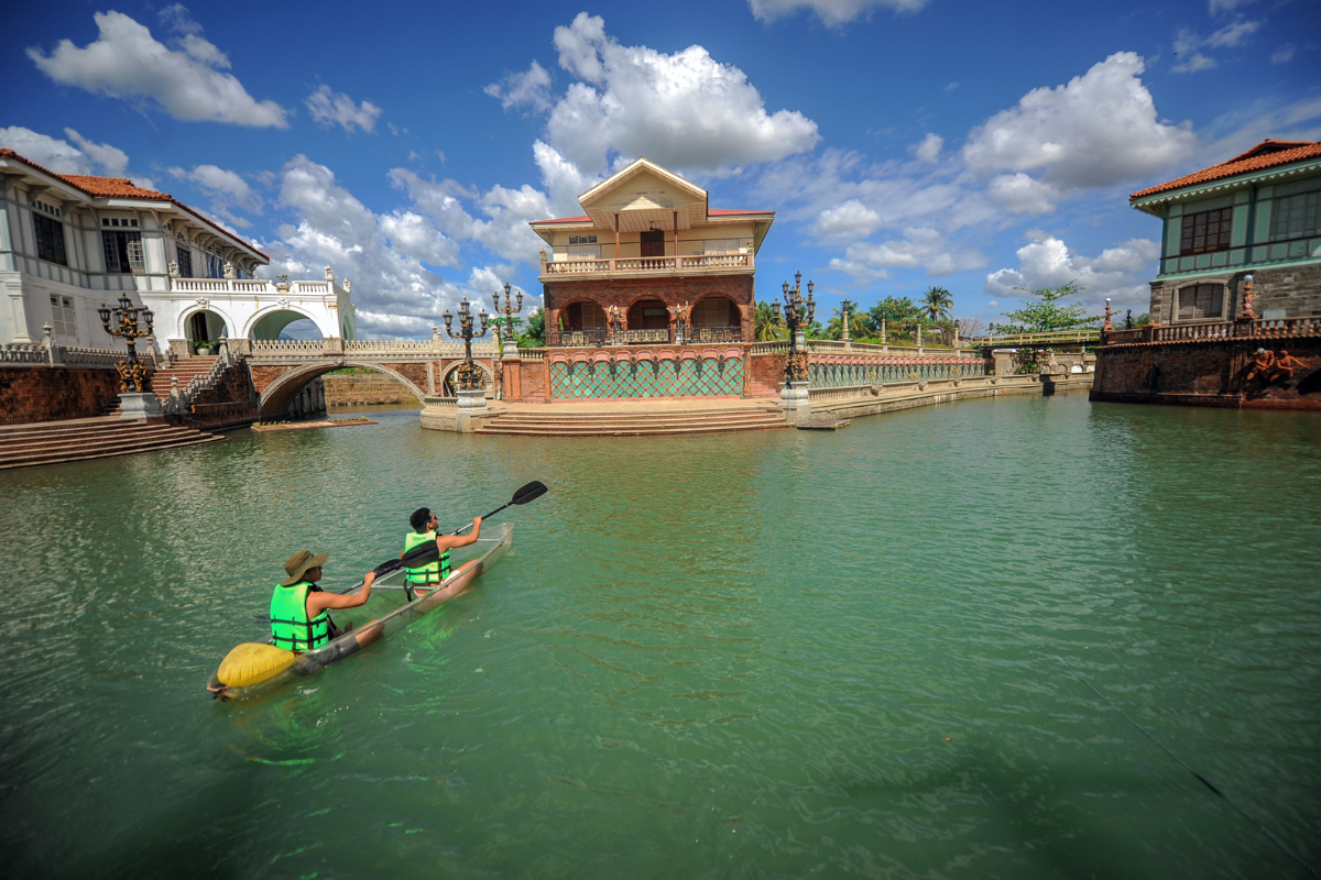 two people in a canoe on a river