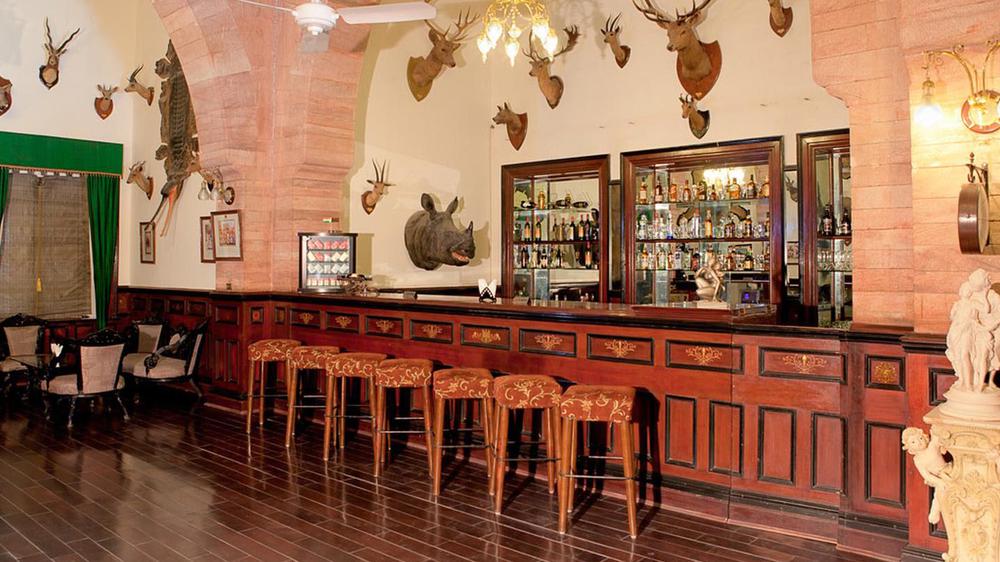 a bar with a counter and stools