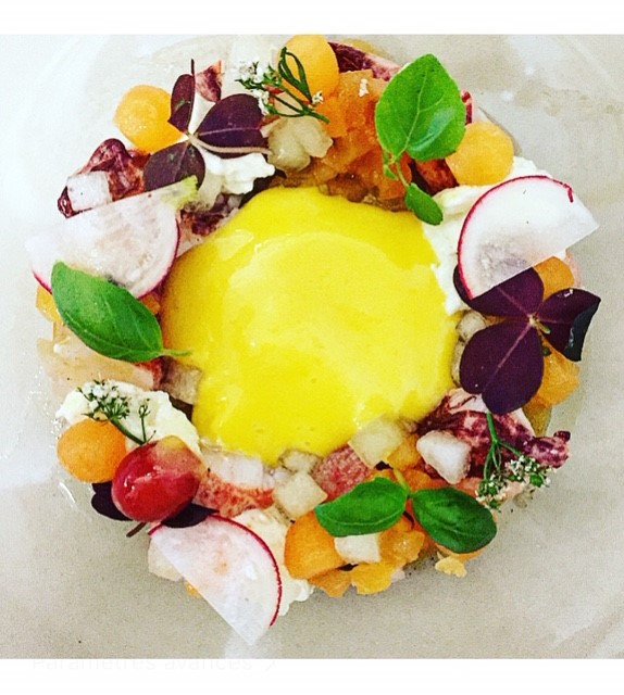 a plate of food with a yellow yolk on top