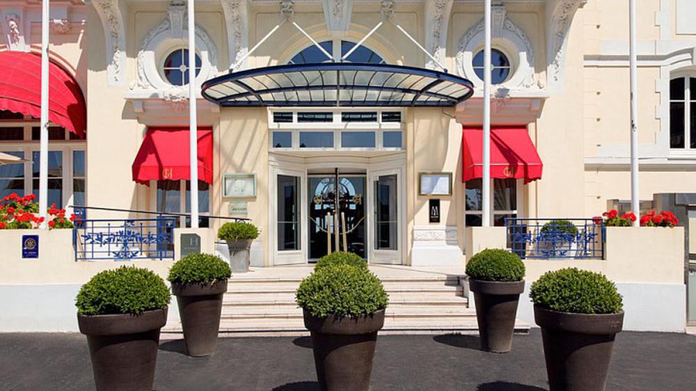a front entrance of a building with a glass roof