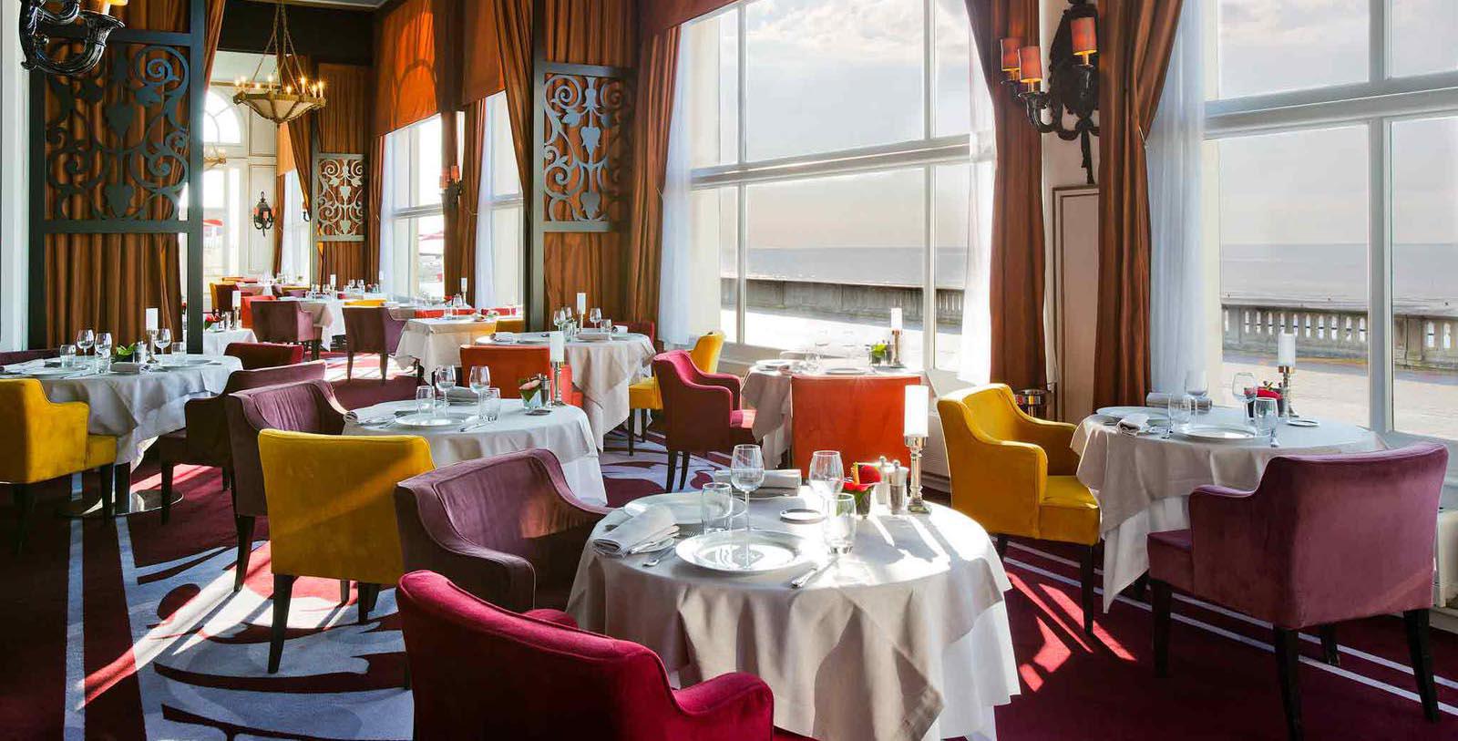 a restaurant with tables and chairs