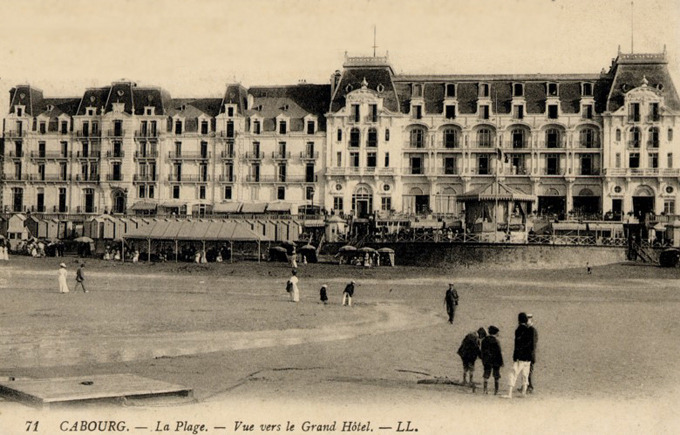 a group of people walking on a beach