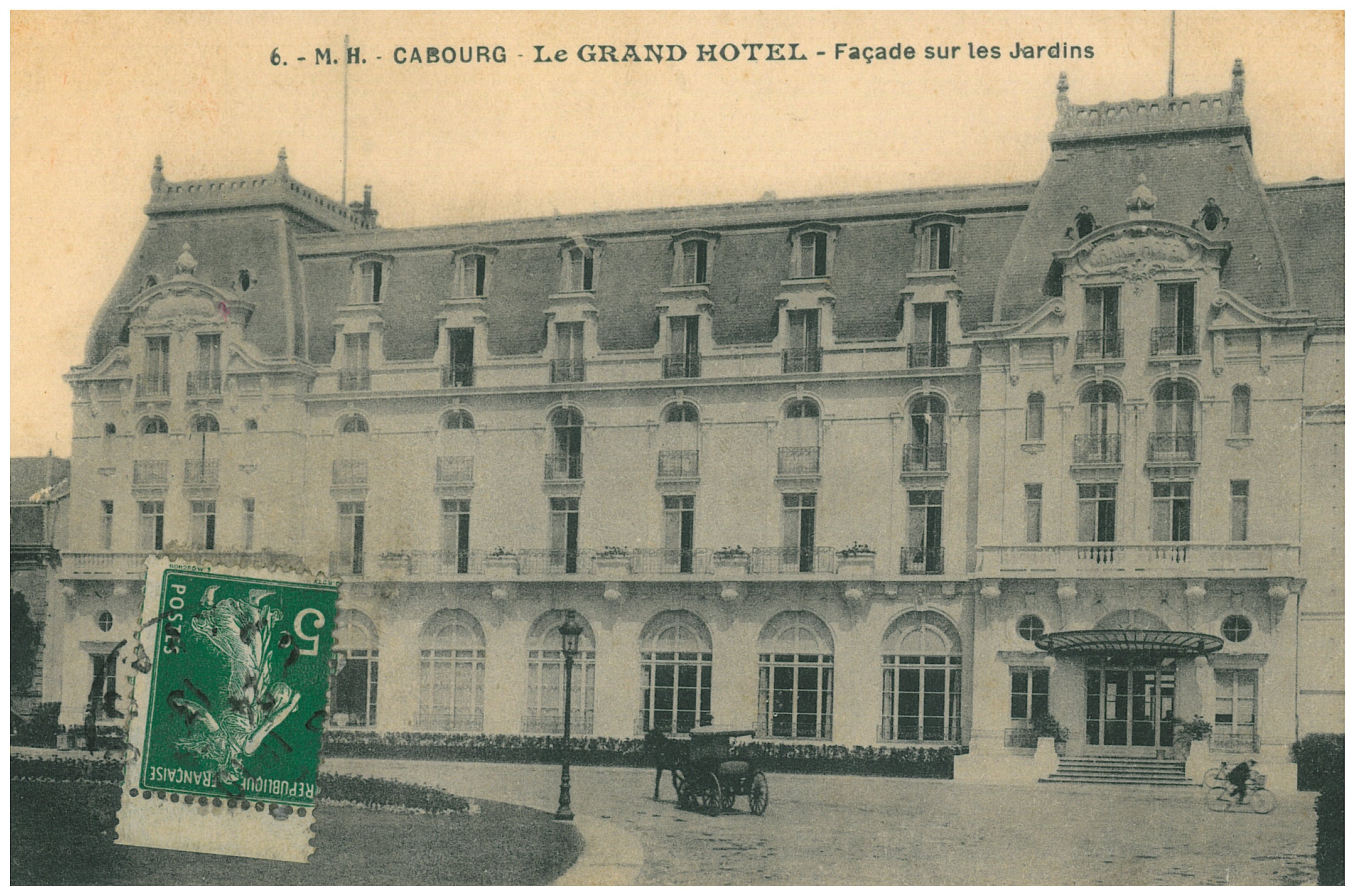 a large building with a carriage in front of it