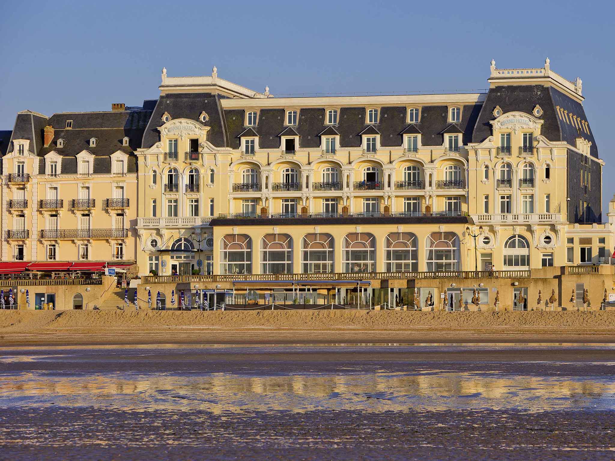 a large building next to a body of water