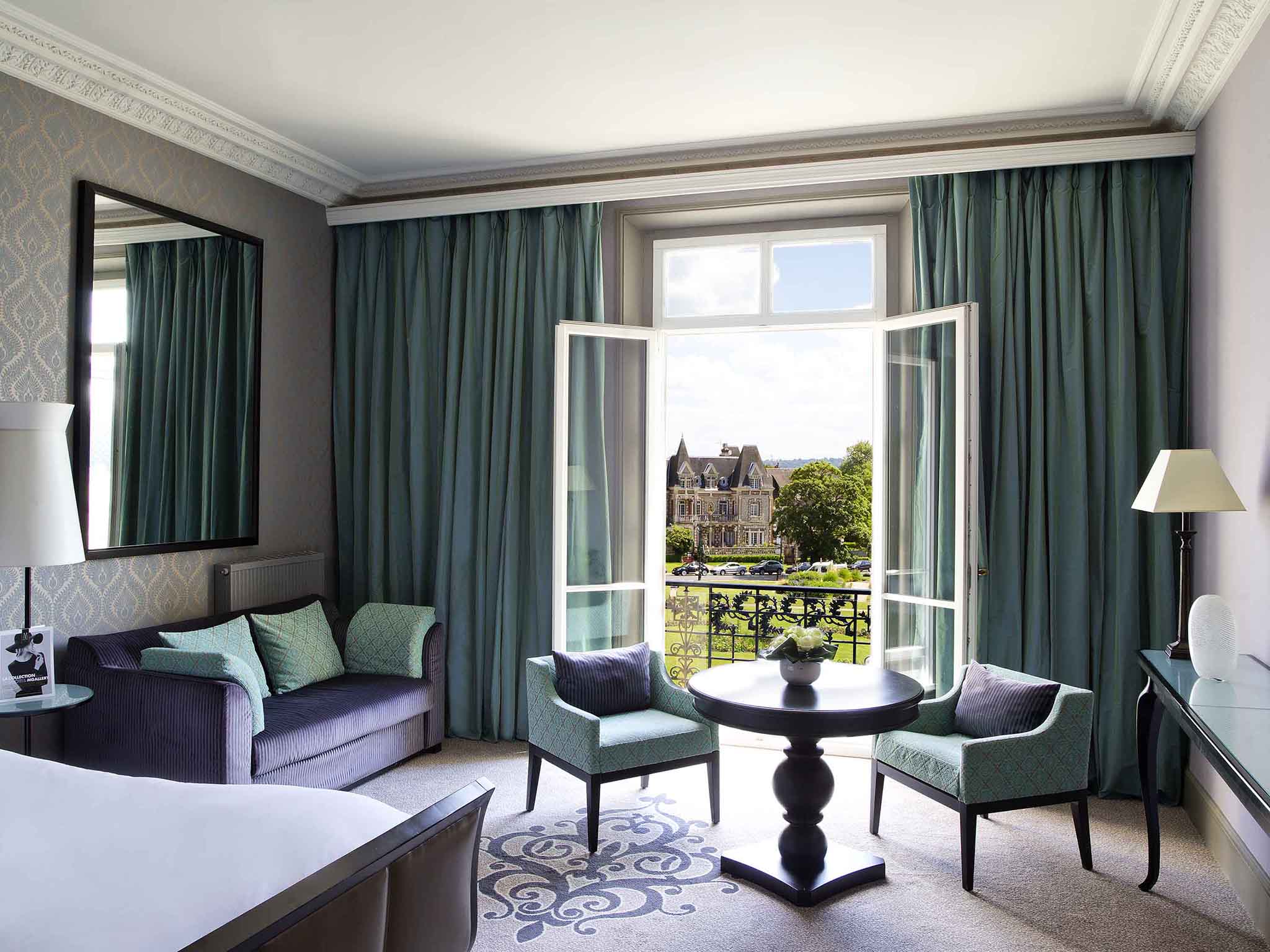 a room with a table and chairs and a table with a window