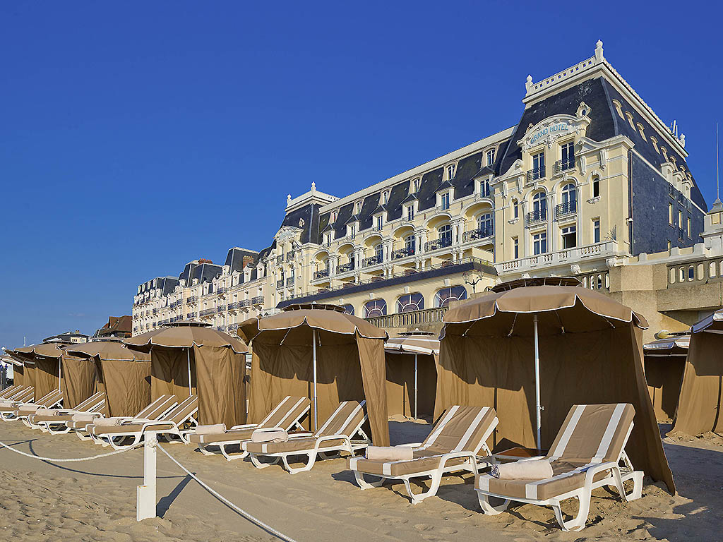 a beach chairs and umbrellas on a beach