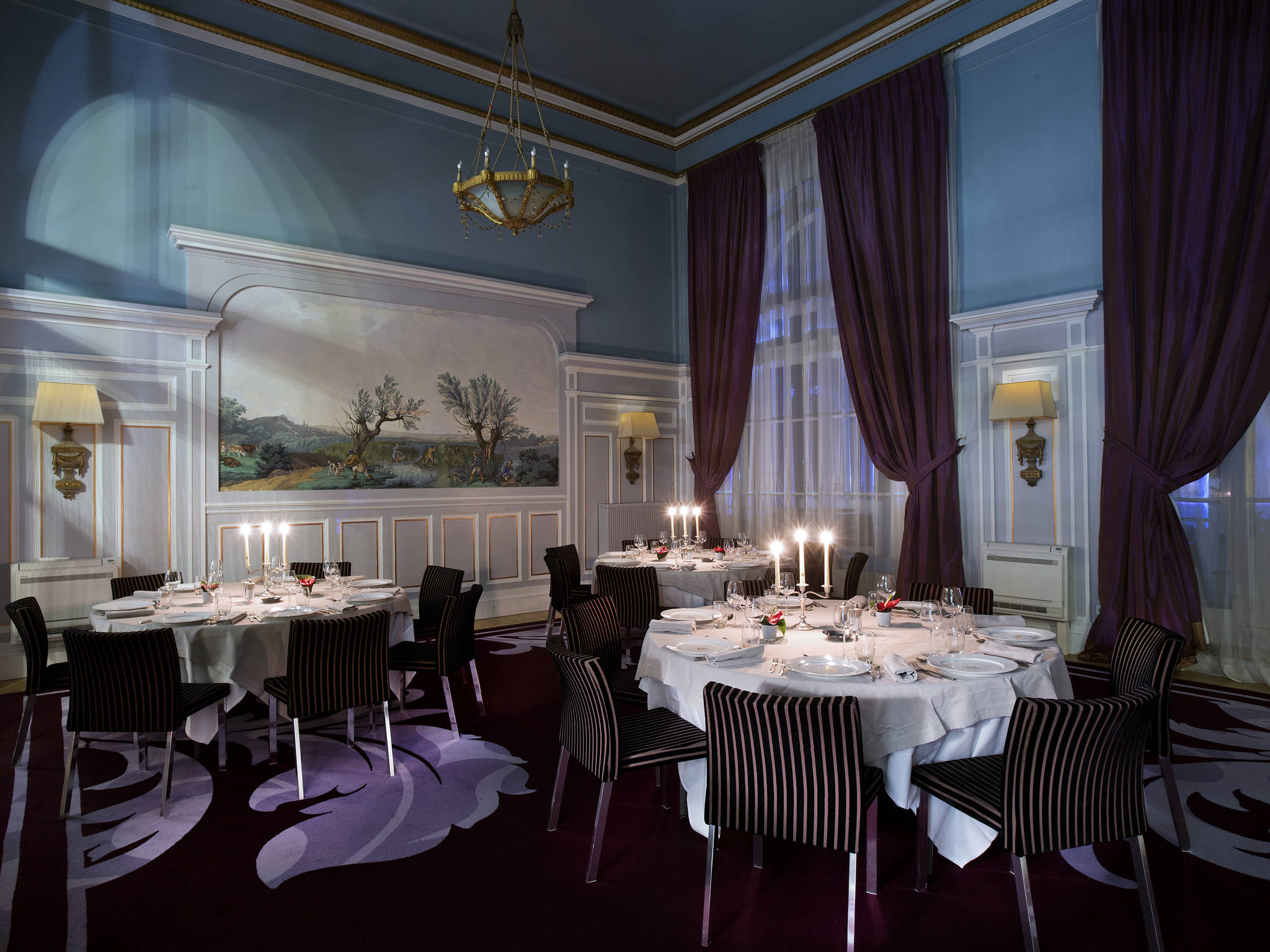 a room with tables and chairs