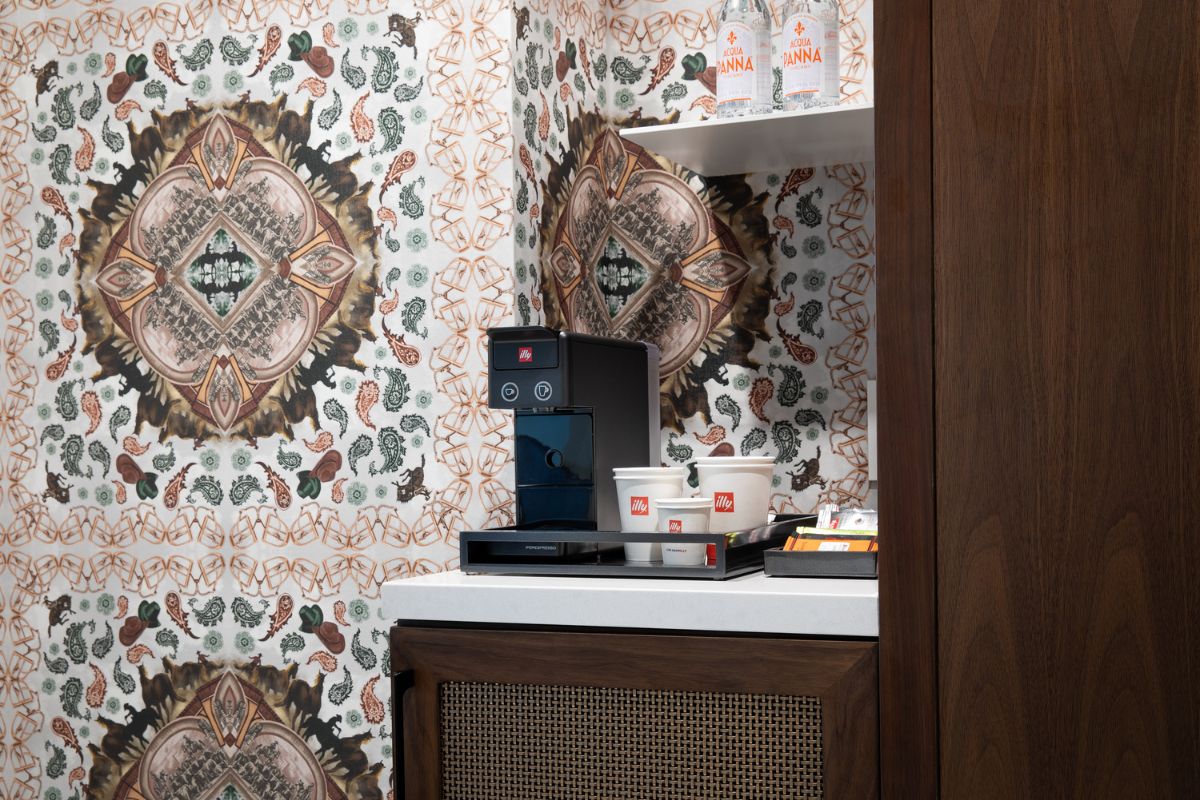a coffee machine and cups on a counter