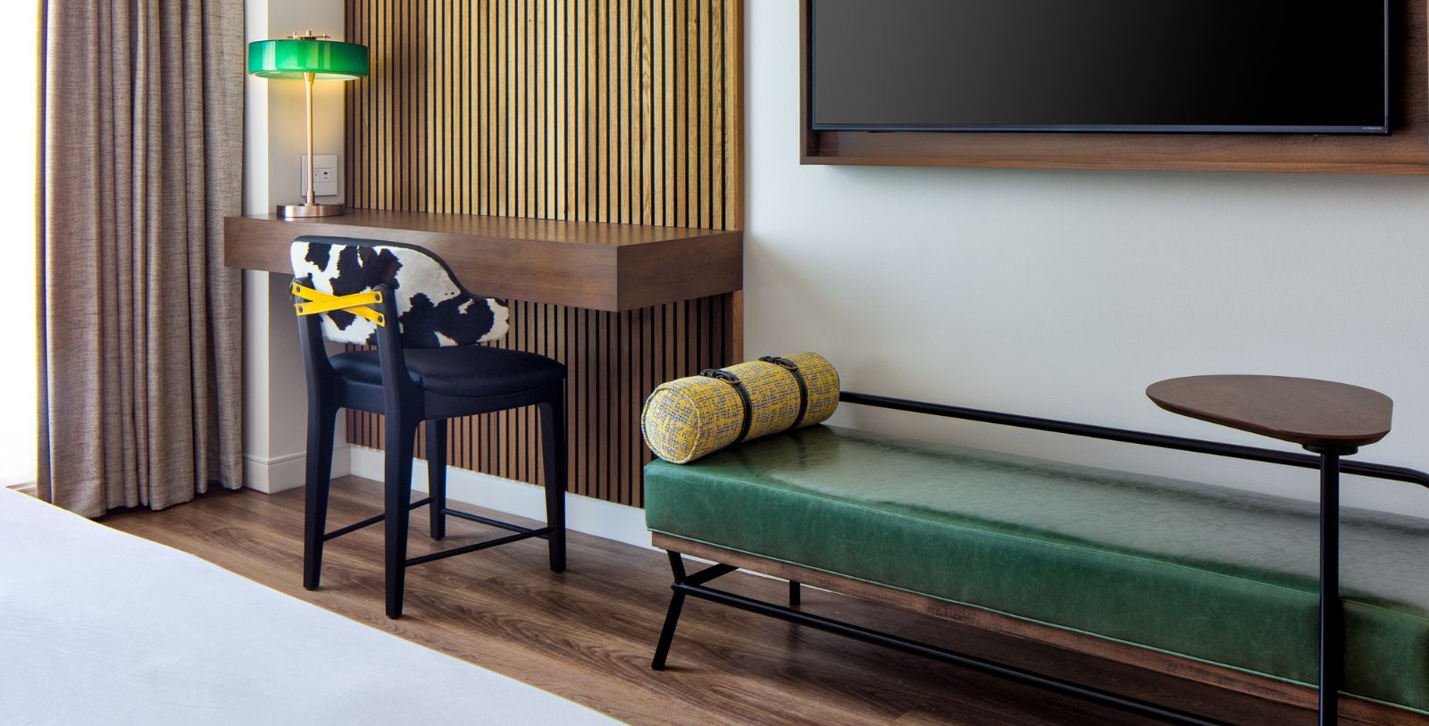 a chair and a green bench in a room