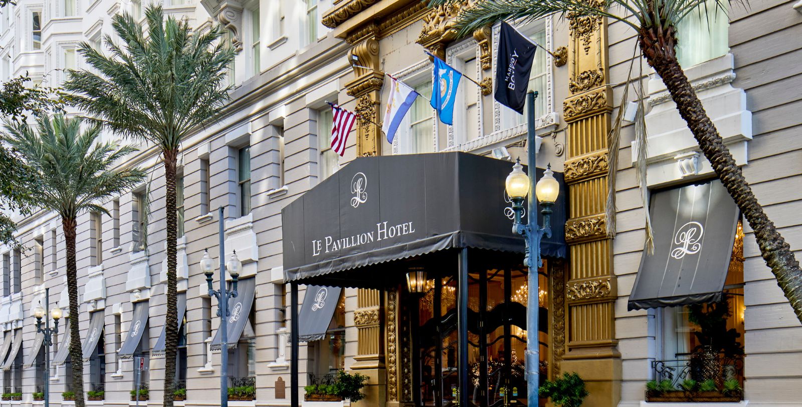 a hotel with flags on the front