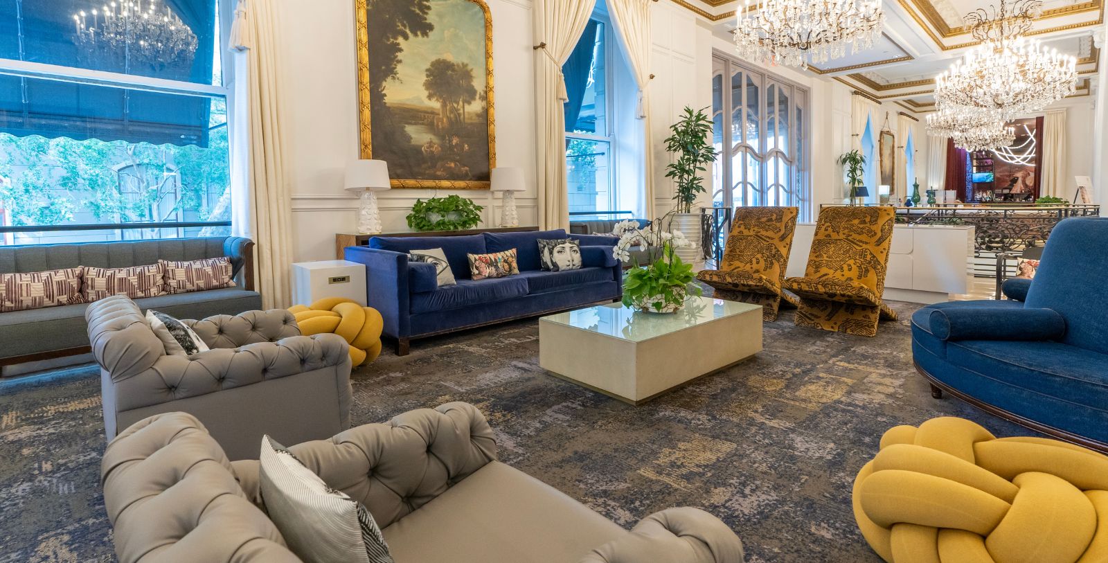 a room with a couch and chairs