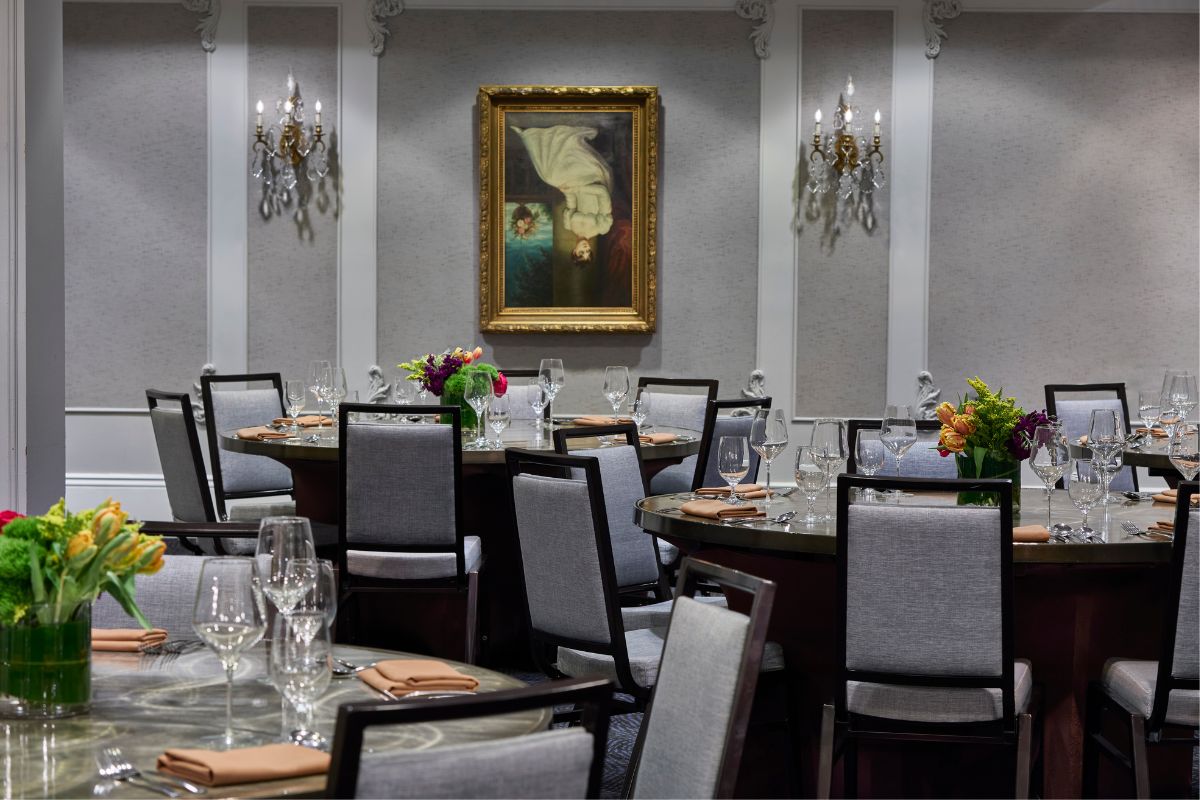 a room with round tables and chairs