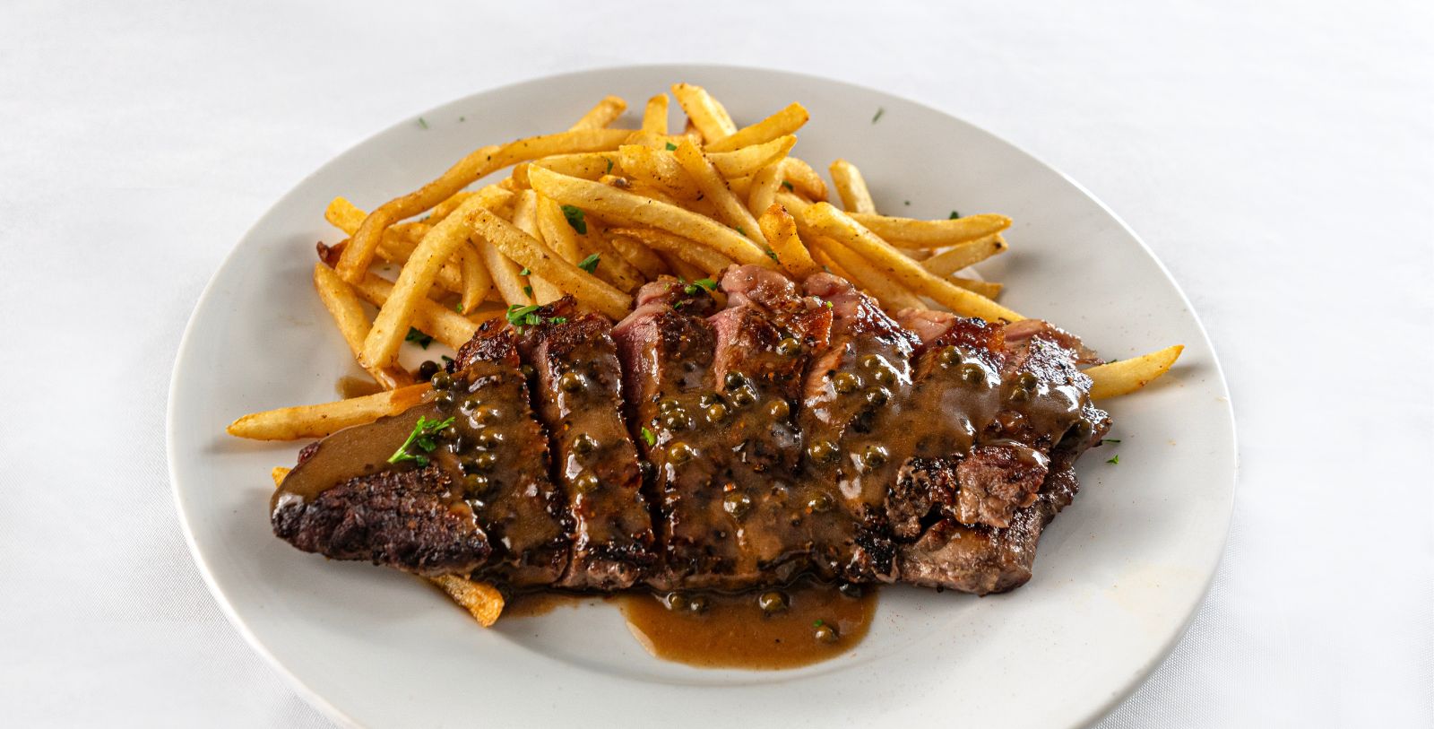 a plate of food with a sauce on it