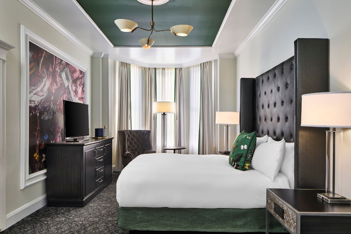 a room with a bed and a tv