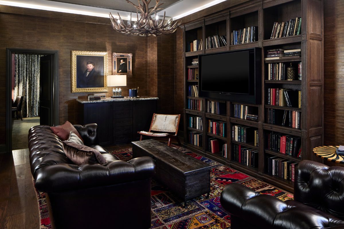 a living room with a couch and bookshelves