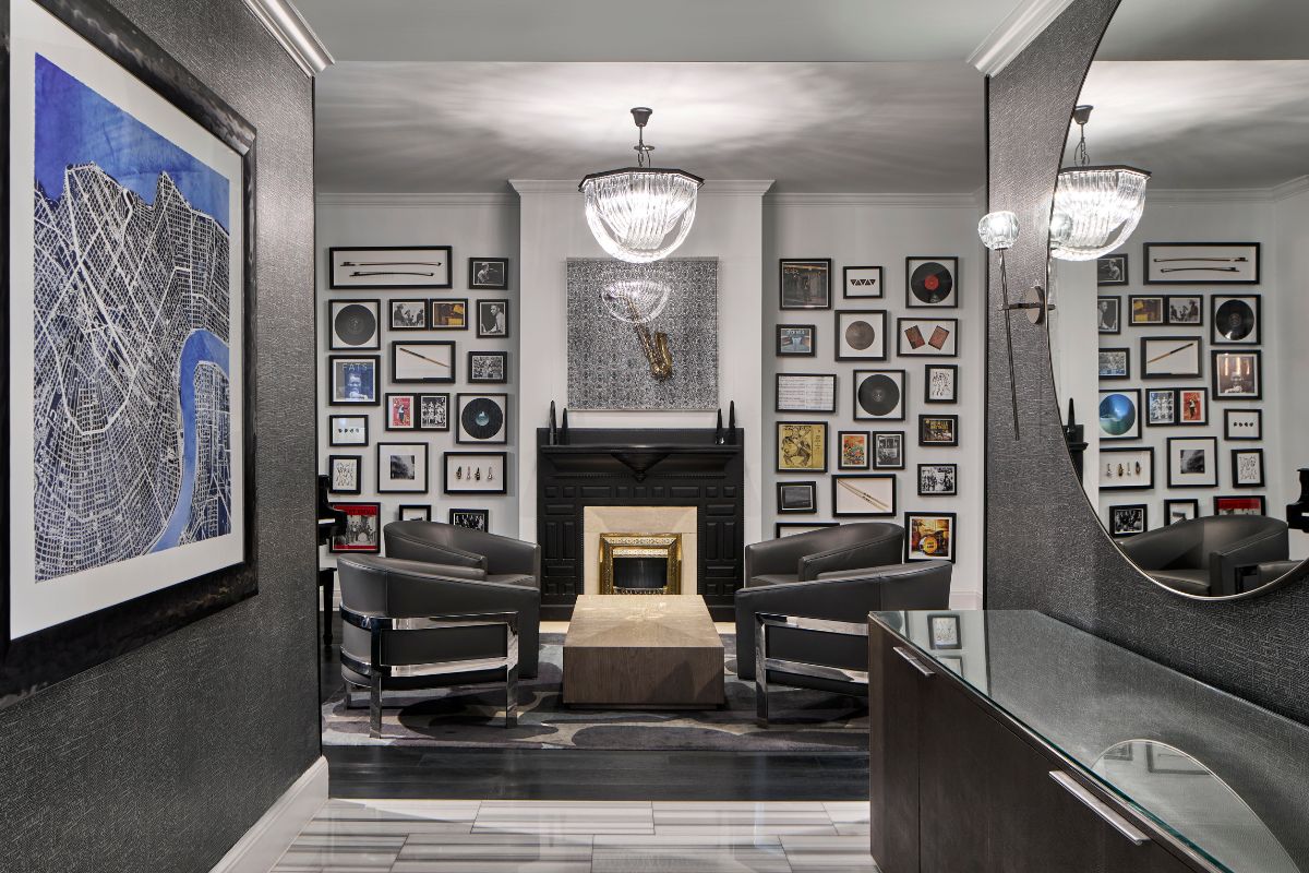 a room with a fireplace and chairs
