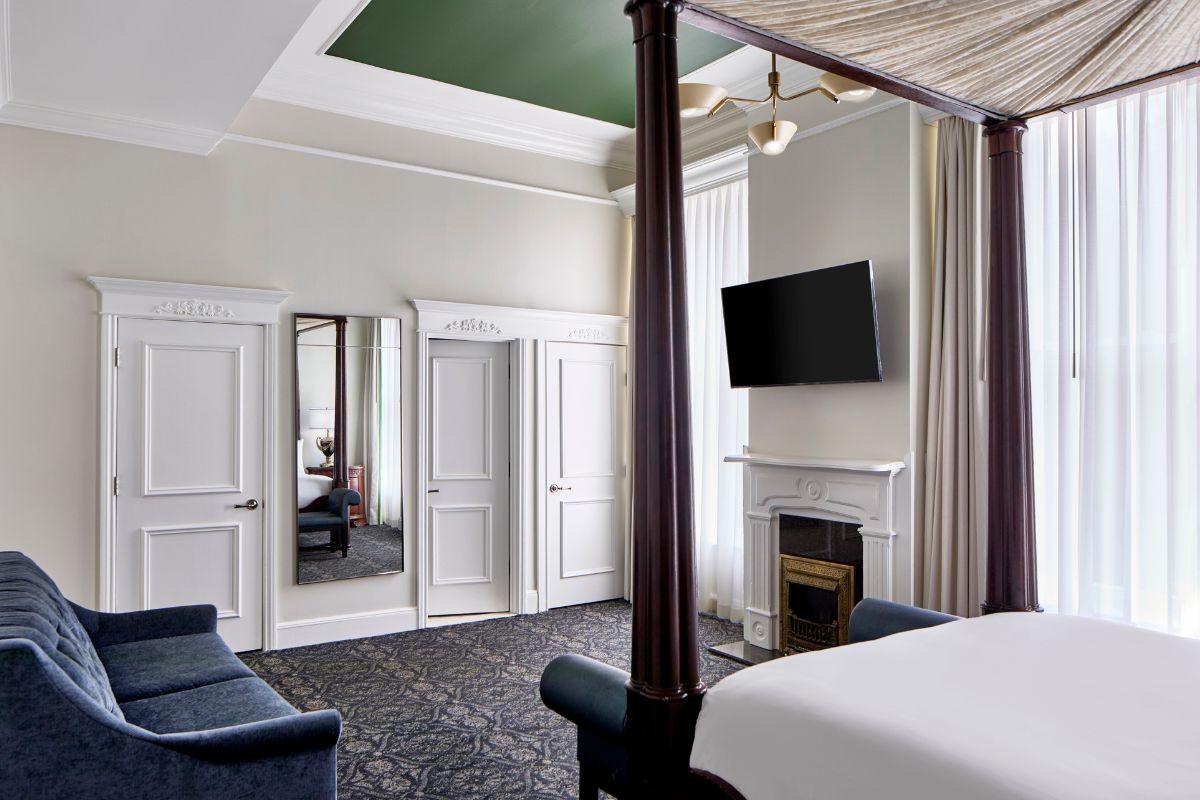 a room with a bed and a television