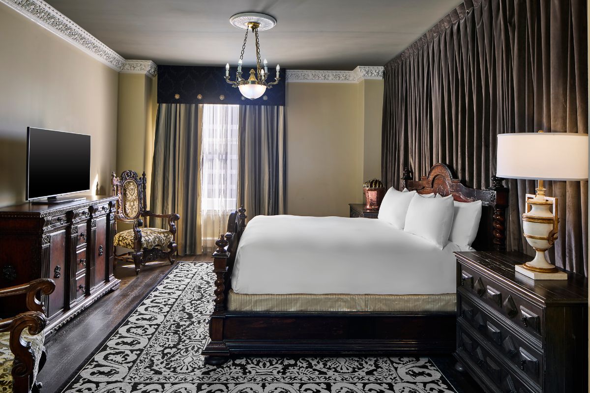 a bedroom with a bed and a rug