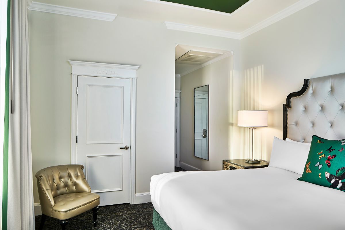 a bedroom with a bed and a chair