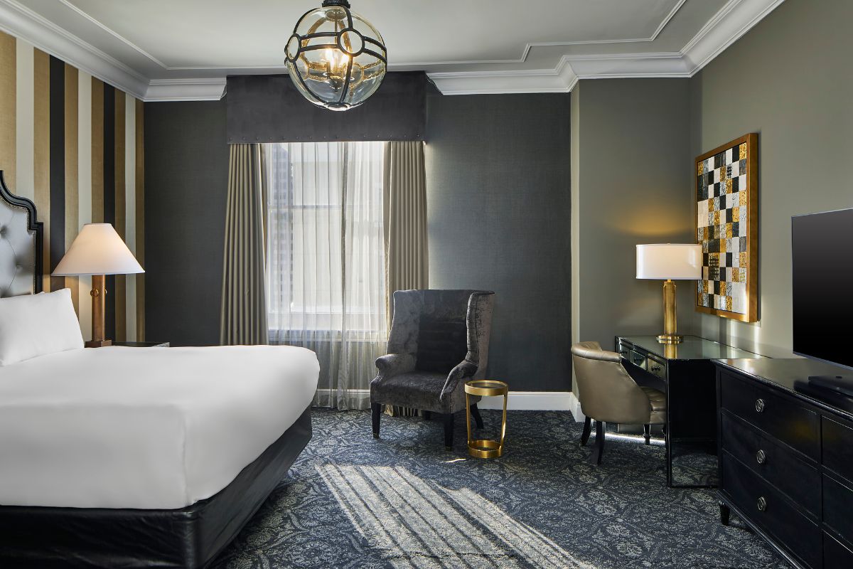 a room with a bed and a desk